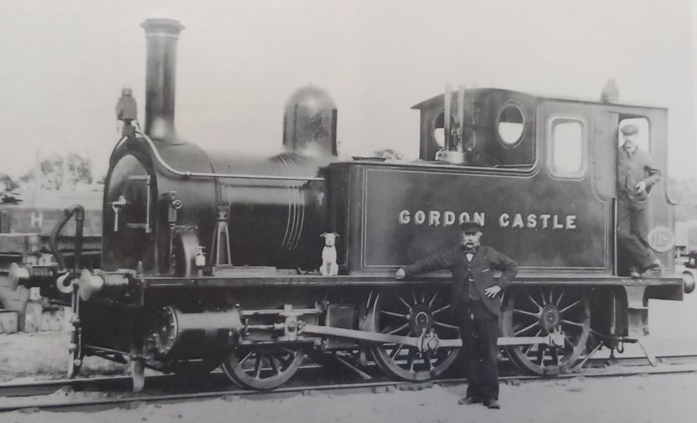 The first private engine of the Duke of Dunrobin, a 2-4-0T (originally named Dunrobin is seen with crew & a little dog in it's Highland Railway condition as 'Gordon Castle'.

