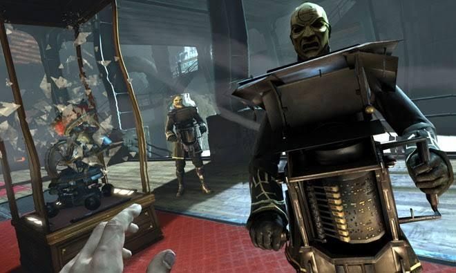 A promotional image from the video game 'Dishonored', depicting a man in a mask wielding a large music box. The main character, who the viewer looks through, puts their hand out, seemingly backing away. 