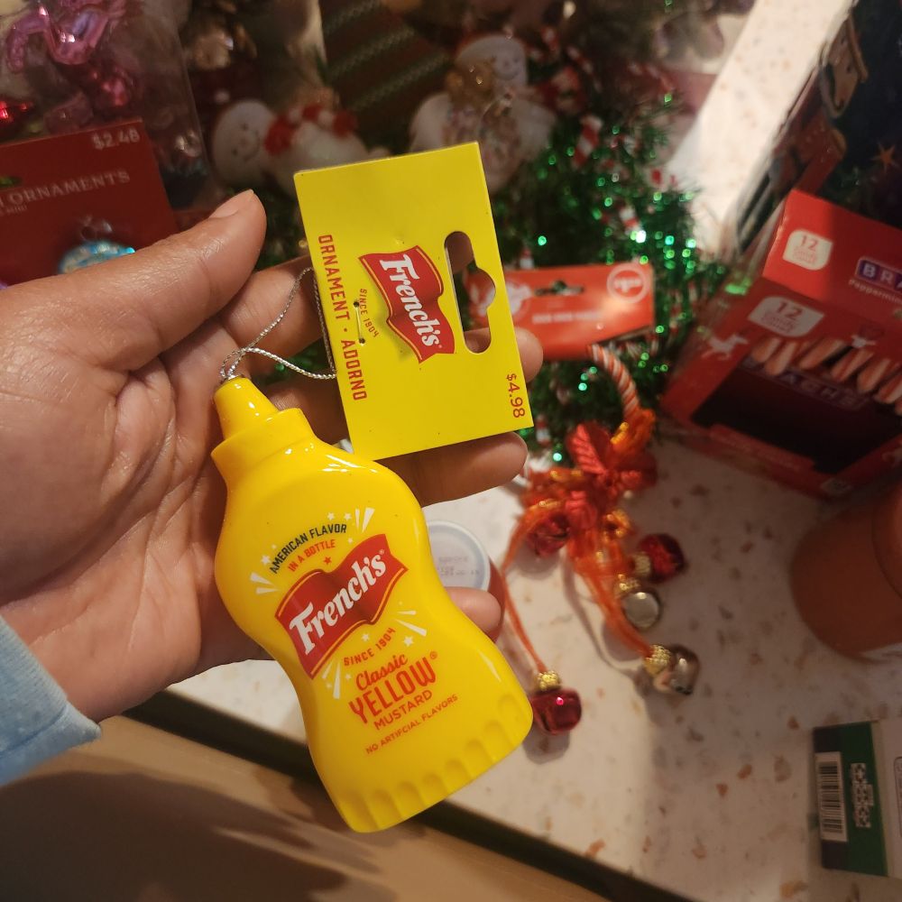 A Christmas tree ornament version of a bottle of Drake's nemesis, Mustard 