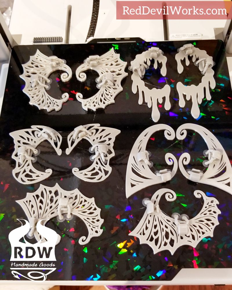 Finished print of ear cuffs on the printer, ready for removal  and finishing. 