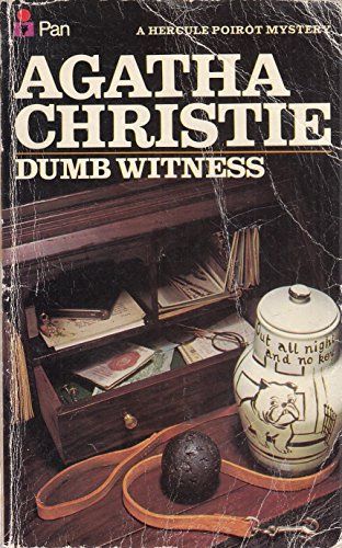 One of the numerous covers of "Dumb Witness" by Agatha Christie. This cover shows an open desk drawer filled with various items: papers, photos, eyeglasses, etc. A small black ball and a brown leash are in front of the drawer along with a large white jar. The jar has been decorated with a picture of a bulldog sitting outside a front door and the words "Out all night and no key."