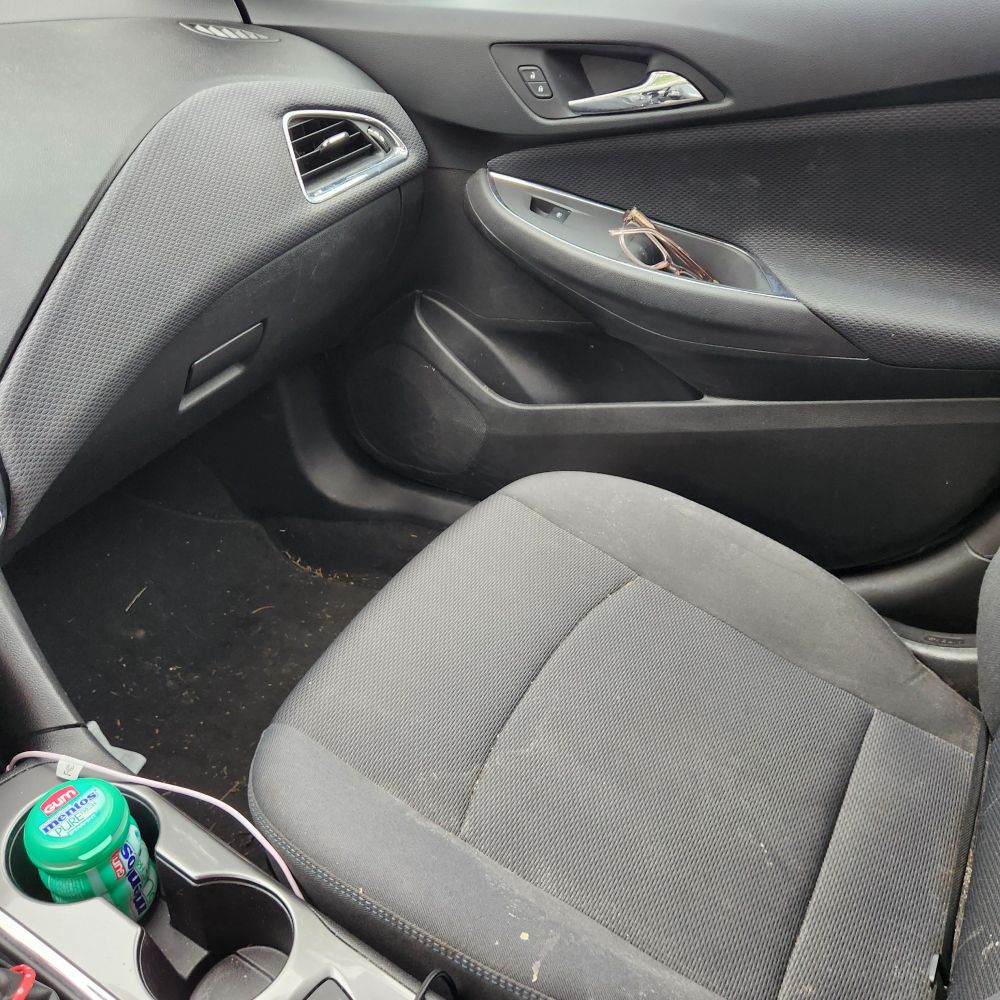 My girlfriend's glasses sitting in the passenger door of my car, don't judge the messy interior