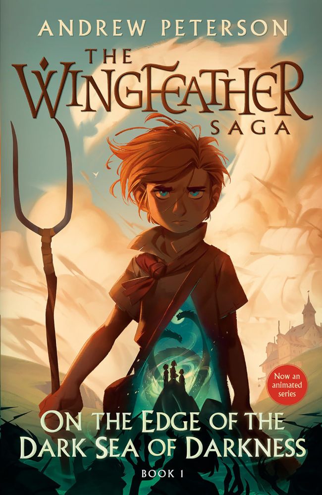 The image is the cover art for the first book in "The Wingfeather Saga" by Andrew Peterson, titled "On the Edge of the Dark Sea of Darkness". It features a young boy, the protagonist, with a somewhat serious or pensive expression. He holds a staff, and a glowing teal circular image on his chest depicts three smaller figures standing on a rock before what seems to be swirling, shadowy creatures. The background suggests a fantasy setting with rolling hills and a distant castle, hinting at a story involving adventure and possibly a magical or mystical element.
