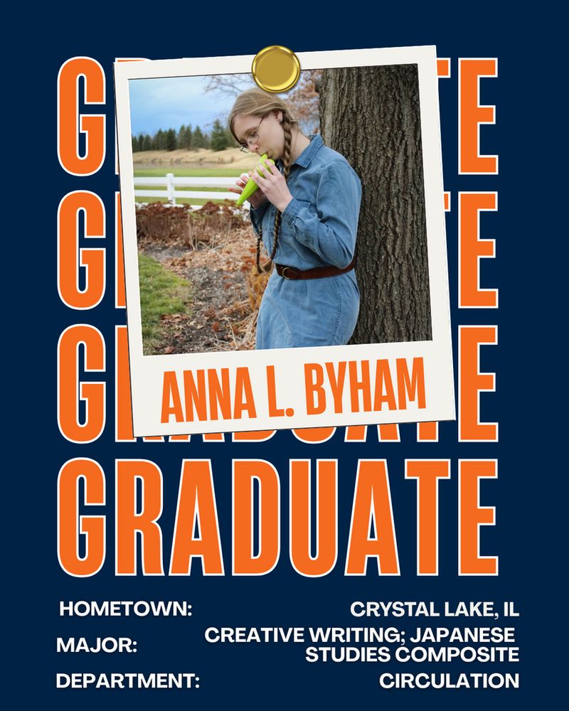 Anna is wearing a denim dress with a brown belt. Her dark blonde hair is in braids and she is wearing glasses. Anna is leaning against a tree playing an ocarina.