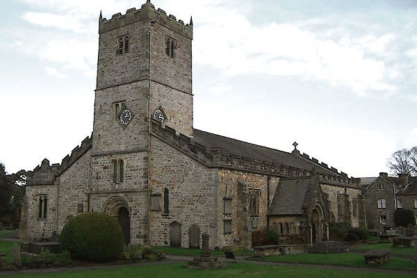 A nice church with a mess of asymmetric clock faces. 