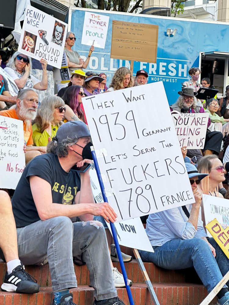 Protest sign: “They want 1939 Germany: let’s serve the fuckers 1789 France.”
