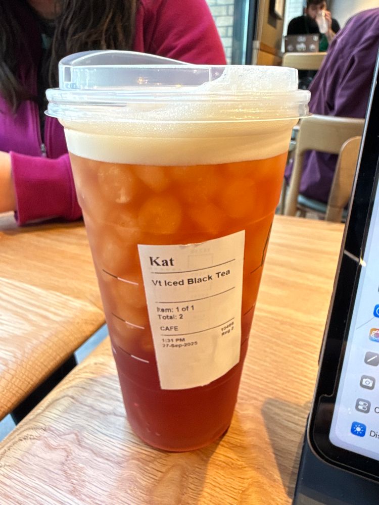 Starbucks cup with label reading “Kat”