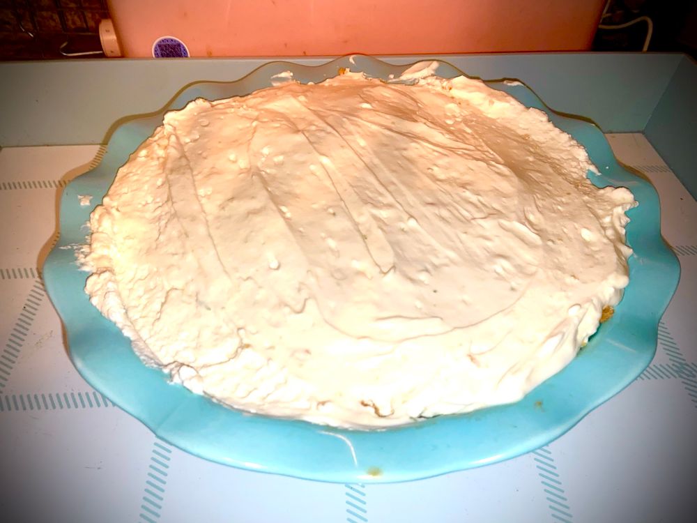 no bake altantic beach pie cheesecake in a blue pie dish 