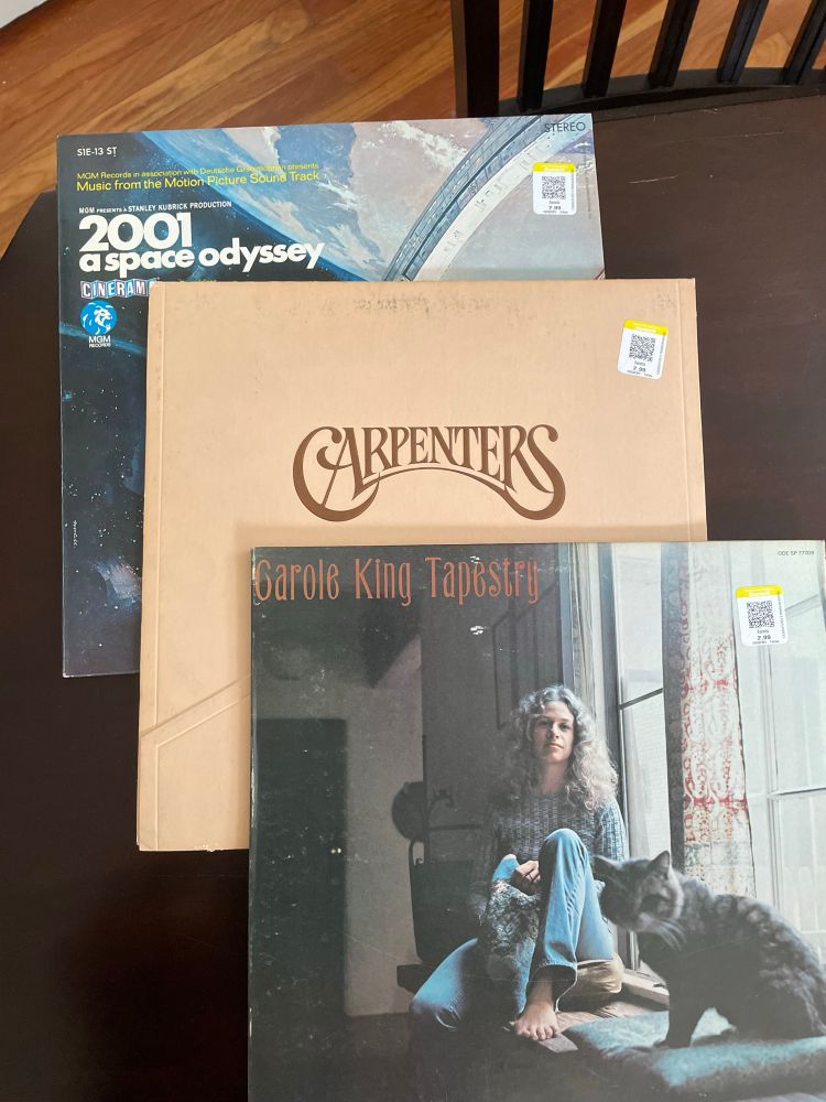 picture of three used records: 2001 a space odyssey movie soundtrack, carpenters self titled, and tapestry by carole king 