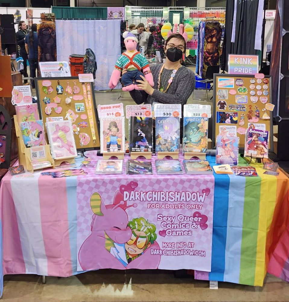 A photo of me at my table at mff 2025!