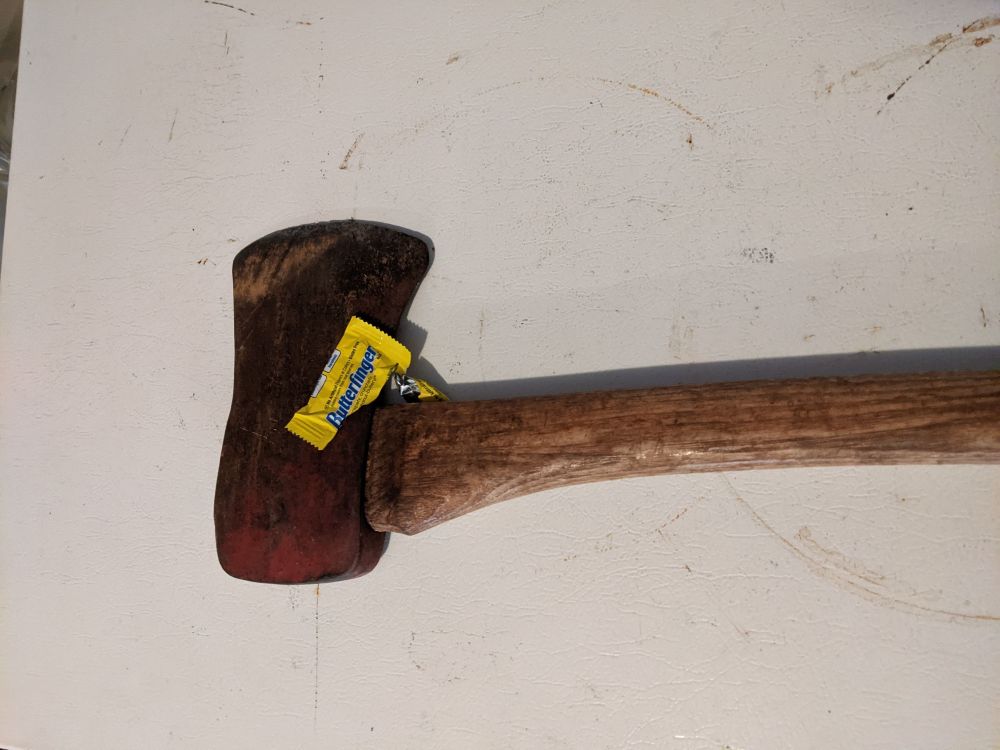 A butterfinger candy, that if you look closely, has an inedible piece of detritus in it.