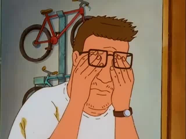 A screenshot of Hank Hill with stubble and sweat stains rubbing his eyes under his glasses 