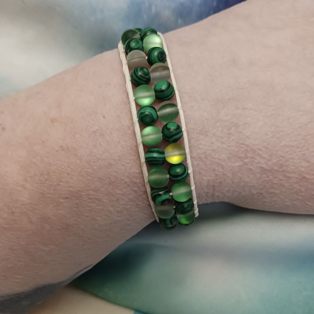 A bracelet I made today with two different types of green beads. The darker ones are resin made to look like malachite. The lighter ones are green, matte-finished mermaid glass.