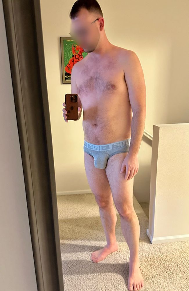 Mostly naked man in gray underwear with a nice bulge if I do say so myself. 