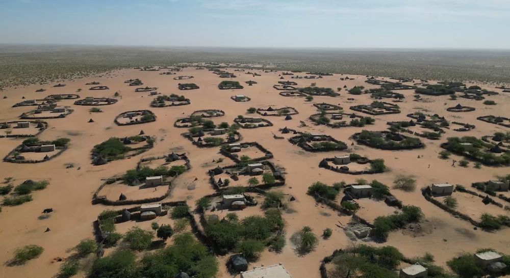 An aerial view of the desert village of Kaou, in Chad’s Kanem province and an oasis on the edge of the desert town of Mao, known as the White City for the limestone used to build homes. The area’s farmers rely on the oasis to grow food but these vital sources of water are disappearing as temperatures get hotter and winds grow stronger, elders say. Video: Julie Bourdin
