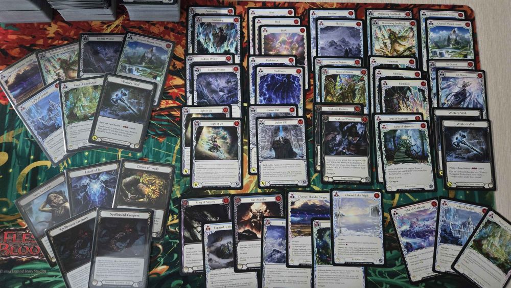 Photo of a playmat displaying all of the Majestics, foil Majestics, and Legendaries from Cay's booster boxes