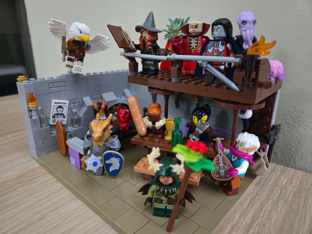 Lego DnD Tavern, with a barkeep, several adventures partying around a table, and and upper floor displaying five iconic DnD villains