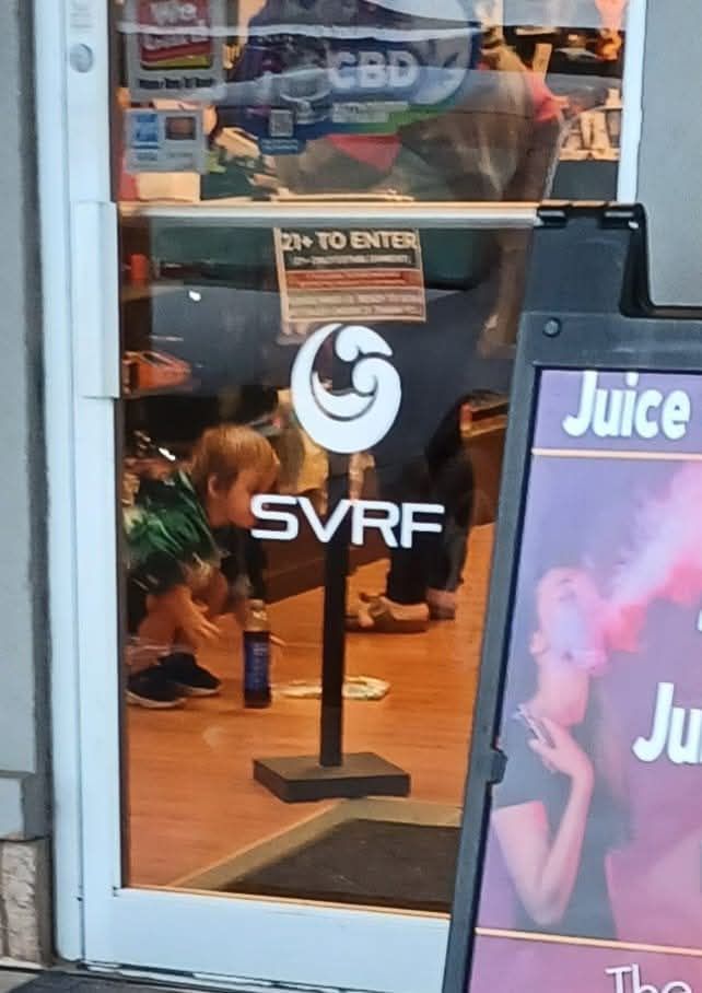 A child inside a 21-to-enter vape store