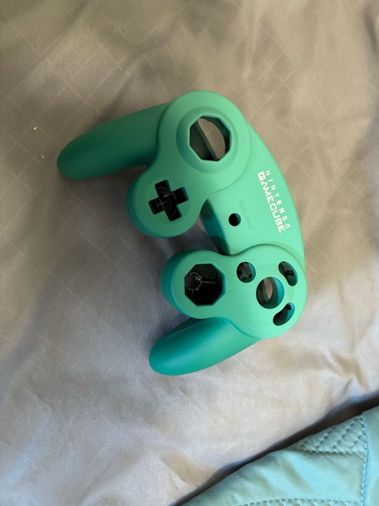 a green painted custom gamecube controller