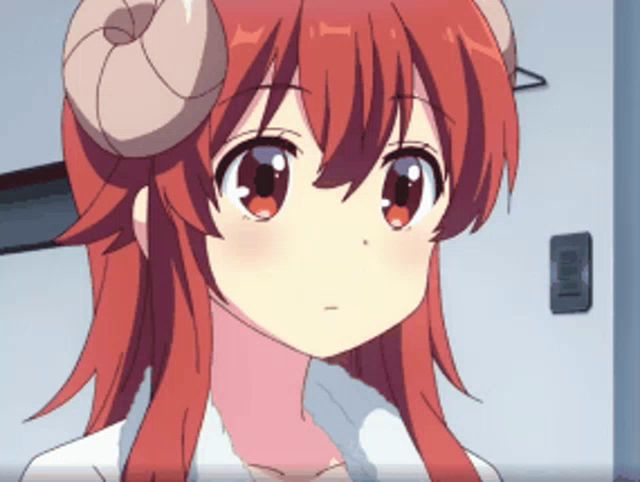 a girl with red hair and horns is looking at the camera