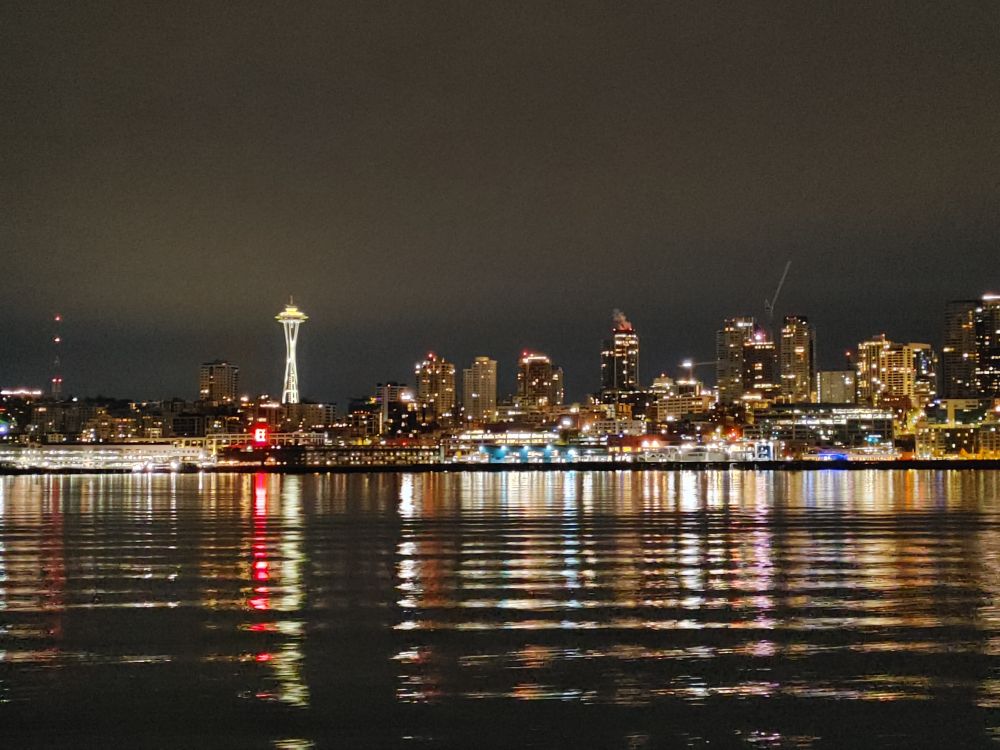 Photo of the receding Seattle skyline taken from aboard the Wenachee on its way to Bainbridge Island. The Space Needle is prominent on the left side of the photo.