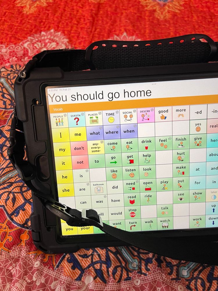 a picture of a tablet with an AAC program open. the sentence bar reads “You should go home”