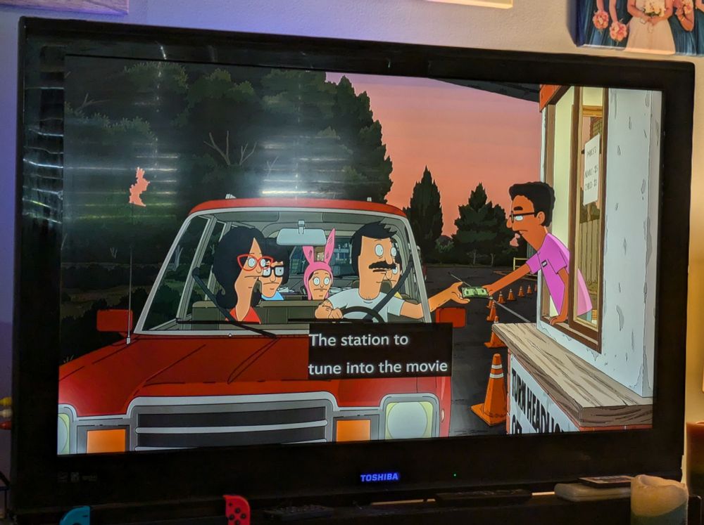 Bob Belcher and his family buying tickets for the drive in theater