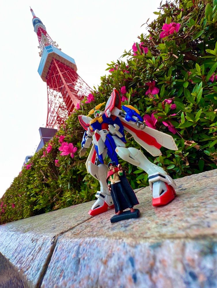 Custom Heroclix of Domon Kasshu and the God Gundam, photographed outside of Tokyo Tower in the Minato district of Tokyo, Japan.