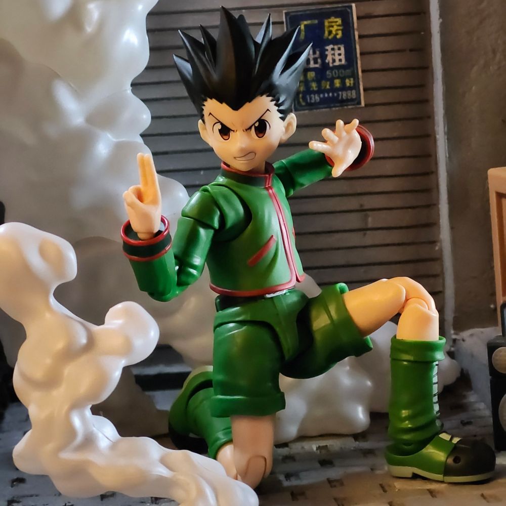 Toy photography: Gon from Hunter x Hunter hits a low kung fu stance in a smokey alley 