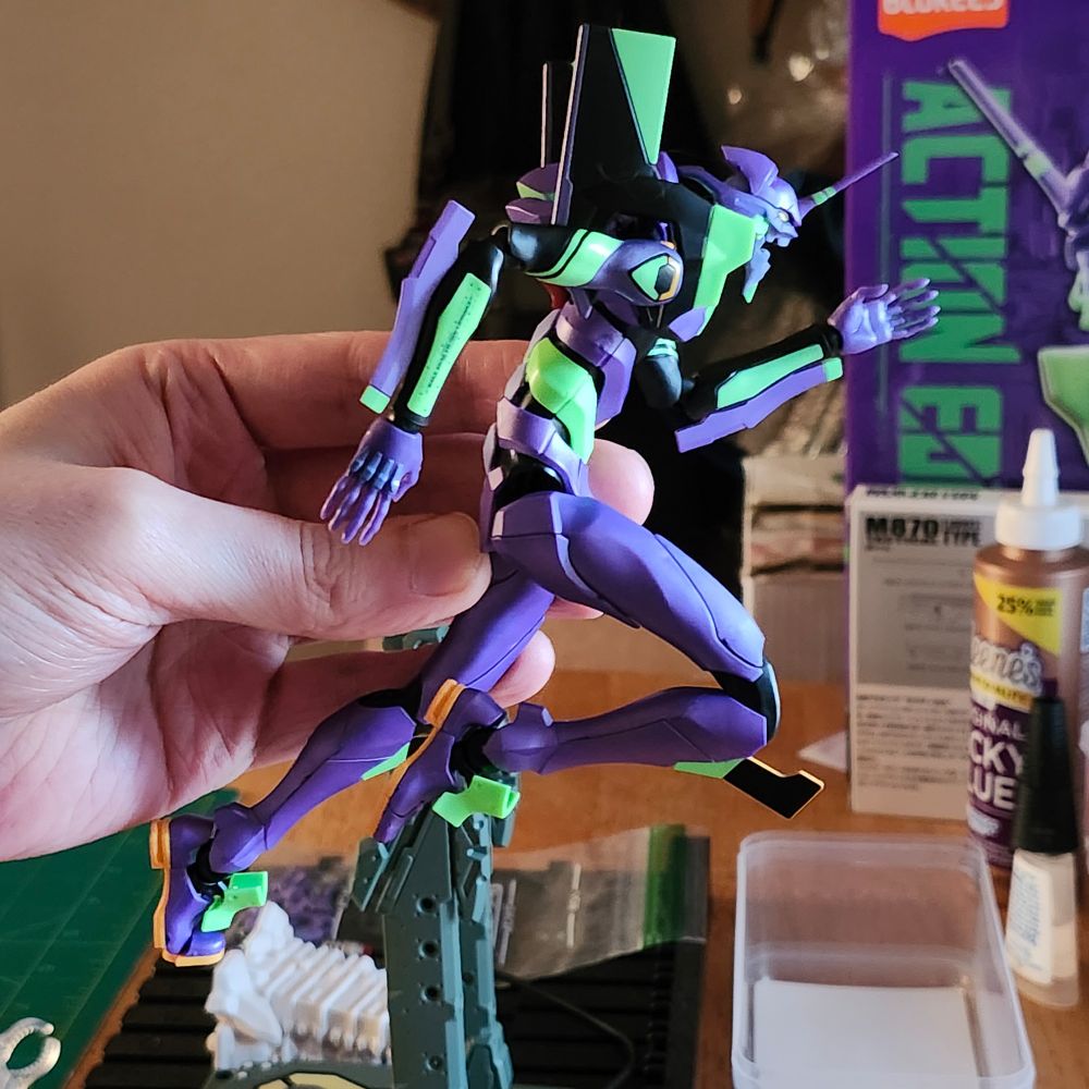 Me holding Blokees NGE Unit 01 model kit in a running pose