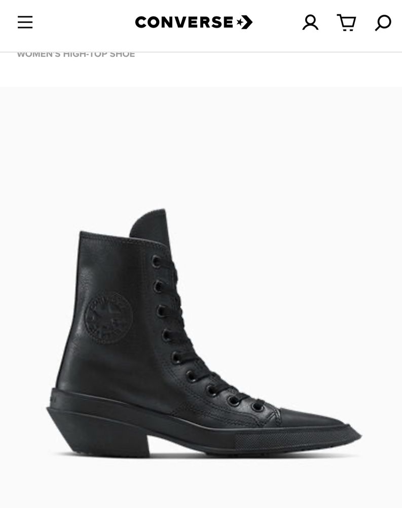 Shot from the side of leather converse with a heel and long pointed toe 