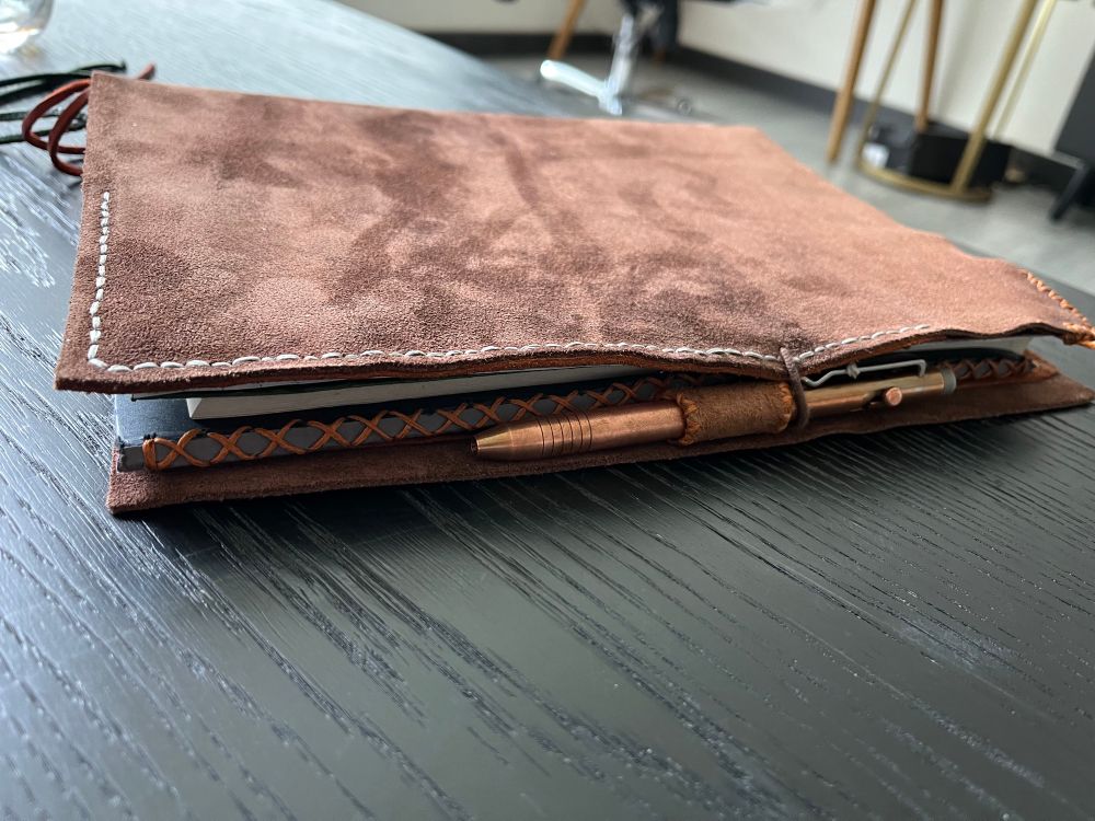 A handmade brown suede notebook