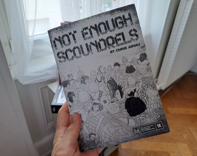 Not Enough Scoundrels black & white cover, zine held by myself. Loads of Lur Noise scoundrels.