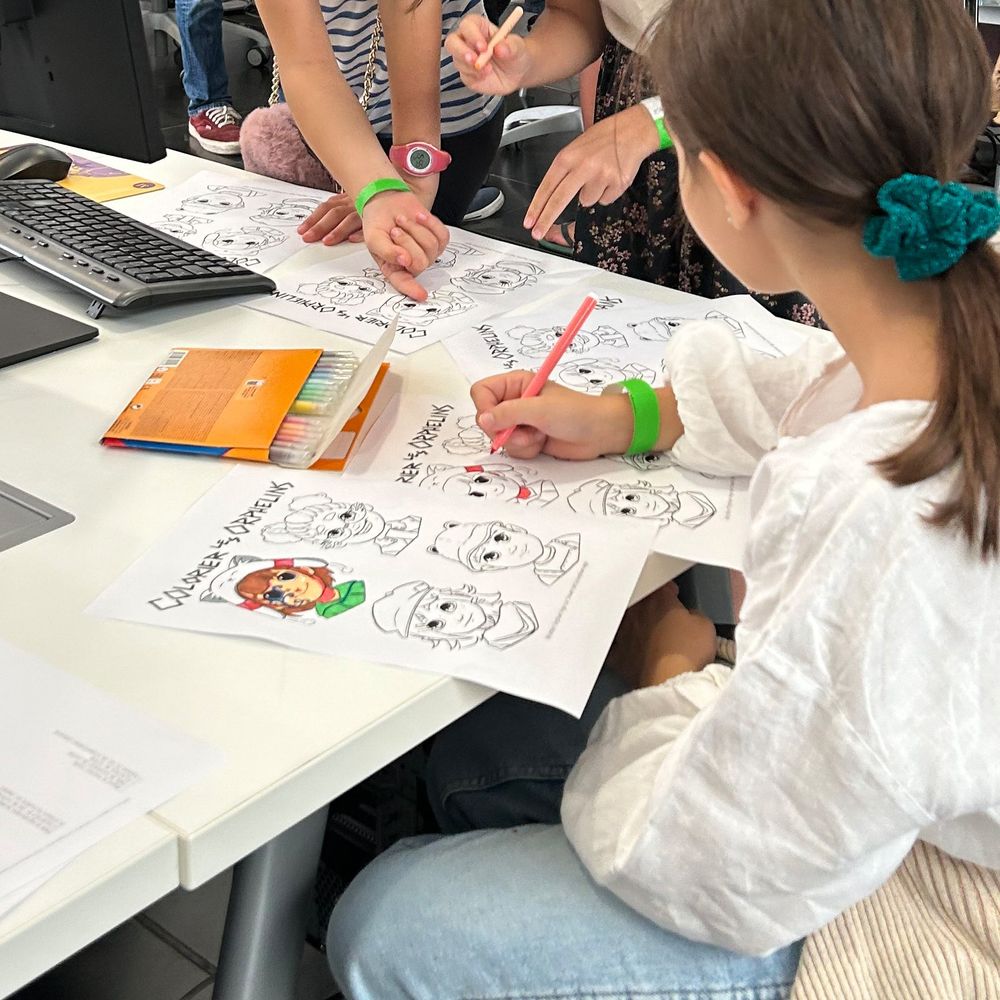 A trio of kids color in coloring pages of the orphans in Orphan Age.