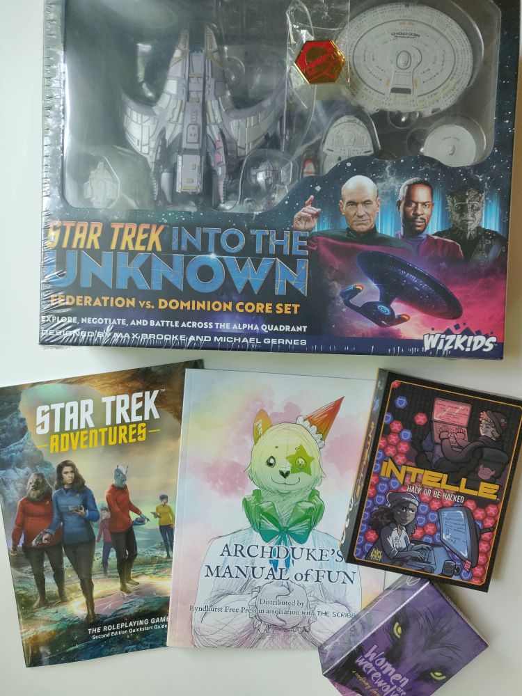 Photo showing the following games: 
Star Trek into the unknown
Star Trek adventures
Archduke's manual of fun
Intelle
Women are werewolves