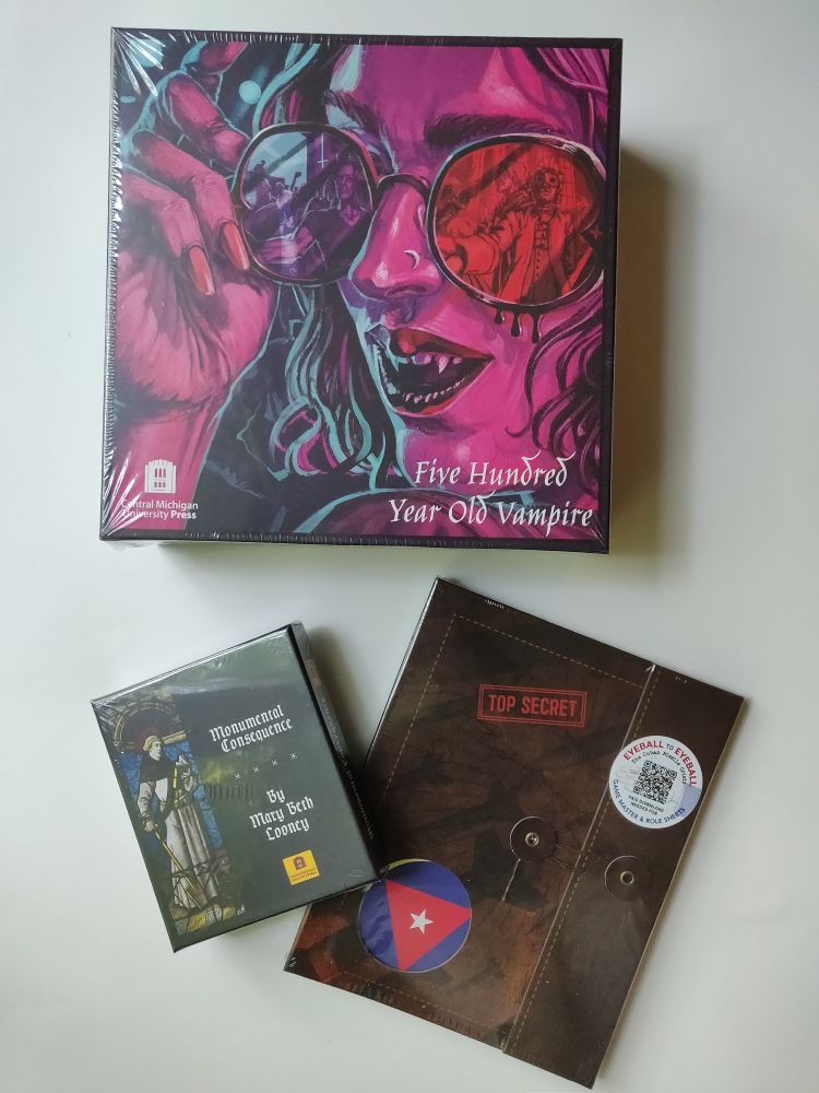 A photo showing the following games: 
Five hundred year old vampire
Monumental consequences
Eyeball to eyeball