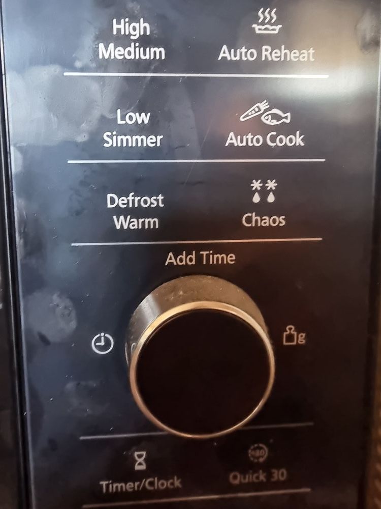 microwave control panel showing a mysterious "Chaos" option with a picture of two snowflakes and raindrops above it