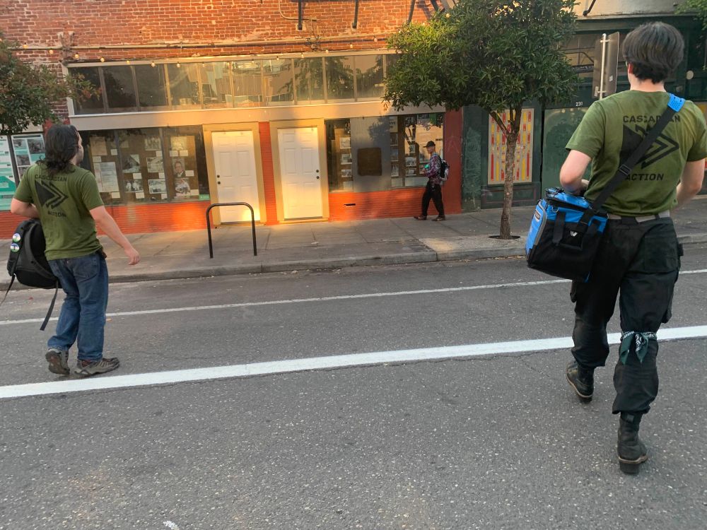 Some personnel crossing the street to hand out supplies 