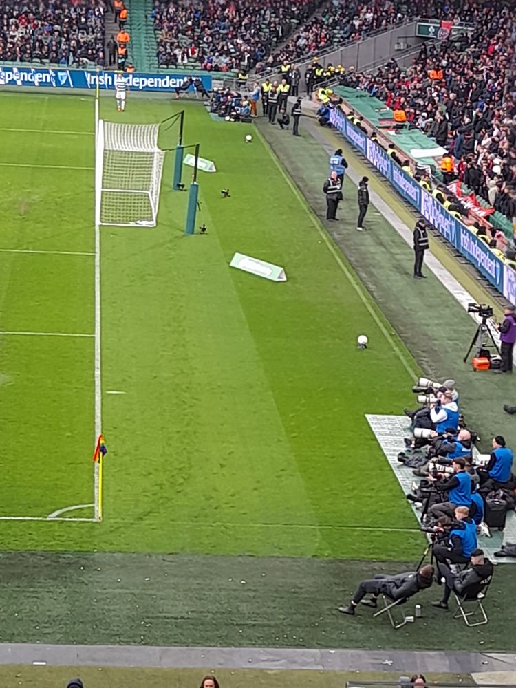 Two banks of multiple photographers in each corner of the South end of the pitch, yesterday at Aviva Stadium, Dublin. They were photographing the league of Ireland match between Bohemian FC and Shamrock Rovers.