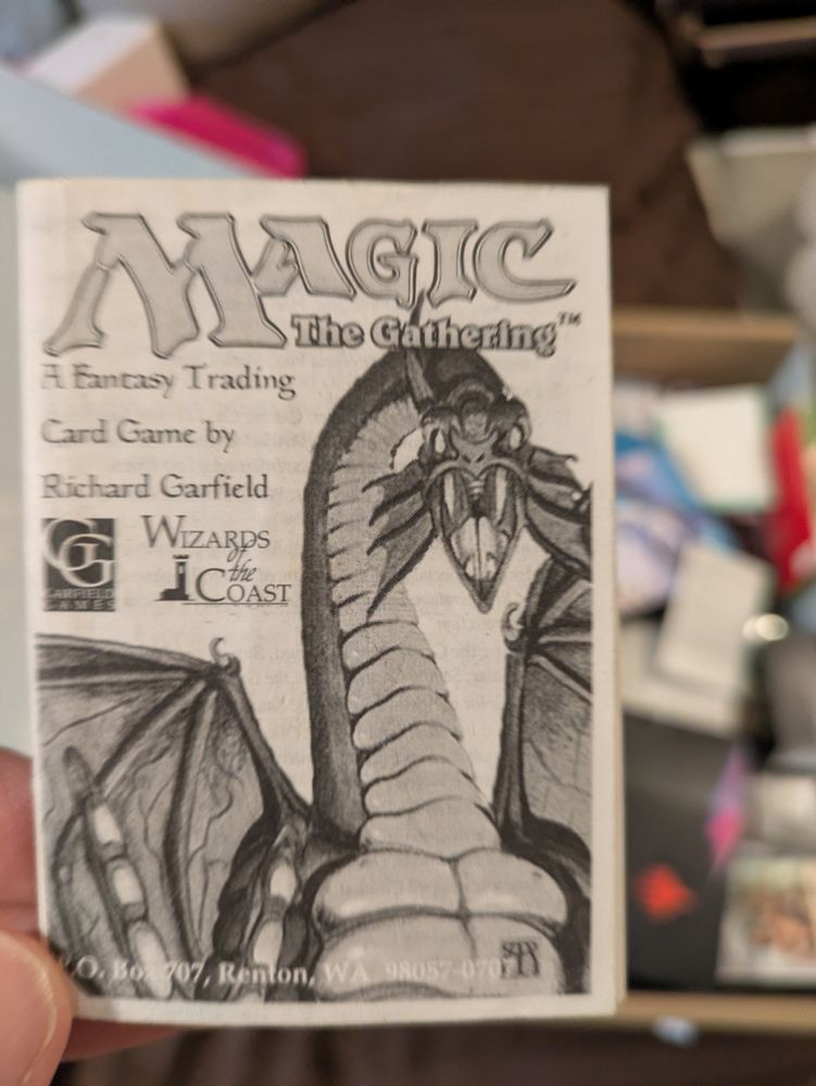 Image of rule book with dragon