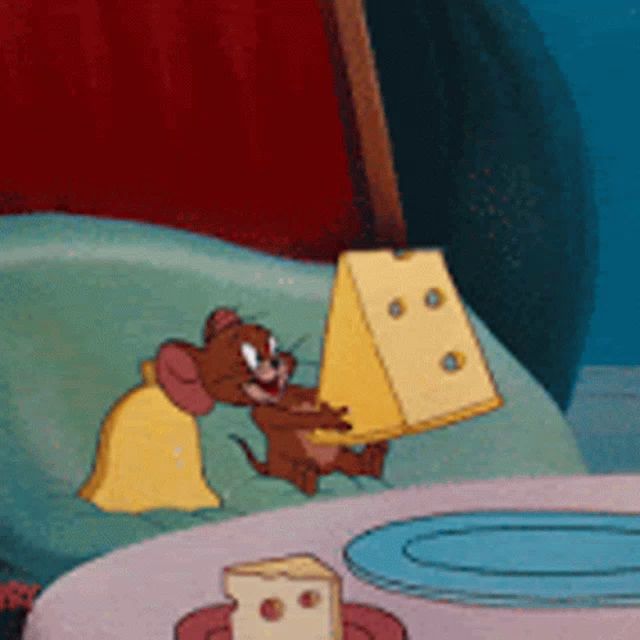 jerry from tom and jerry is holding a slice of cheese