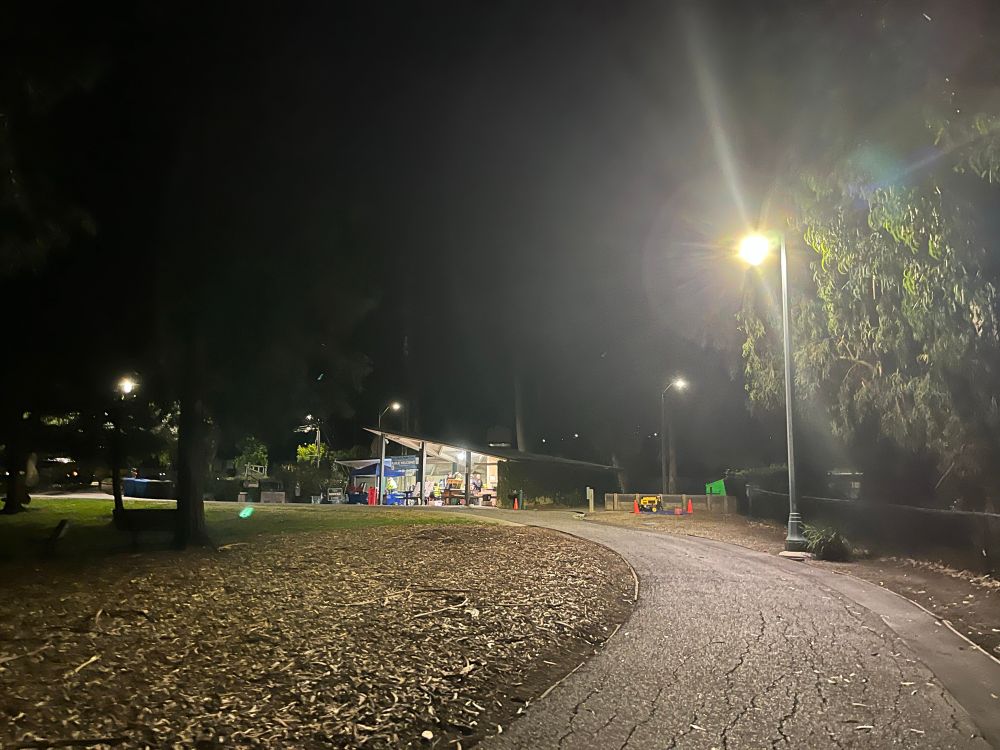 Night time scene with the park shelter in the distance.