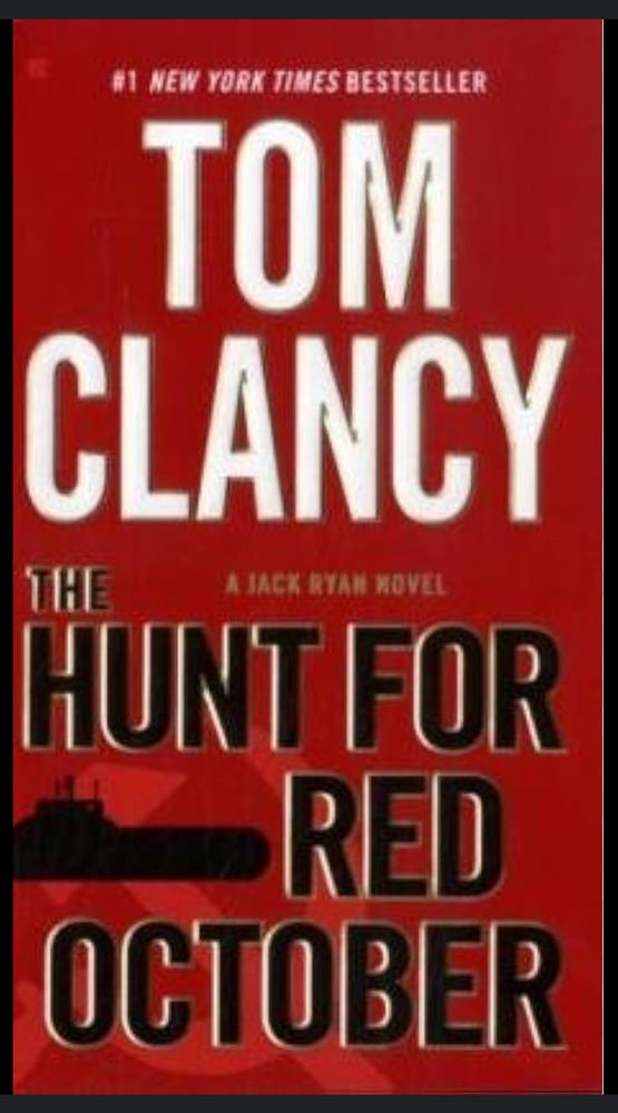 Red book cover with black silhouette of a submarine and title, “The Hunt for Red October” by Tom Clancy