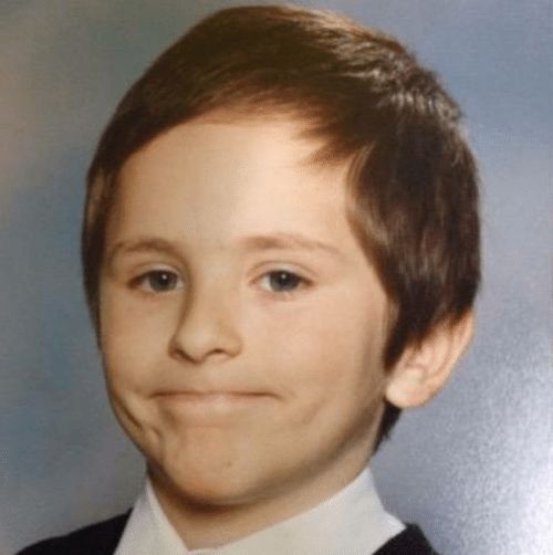 that meme of the kid giving the awkward thin-lipped smile