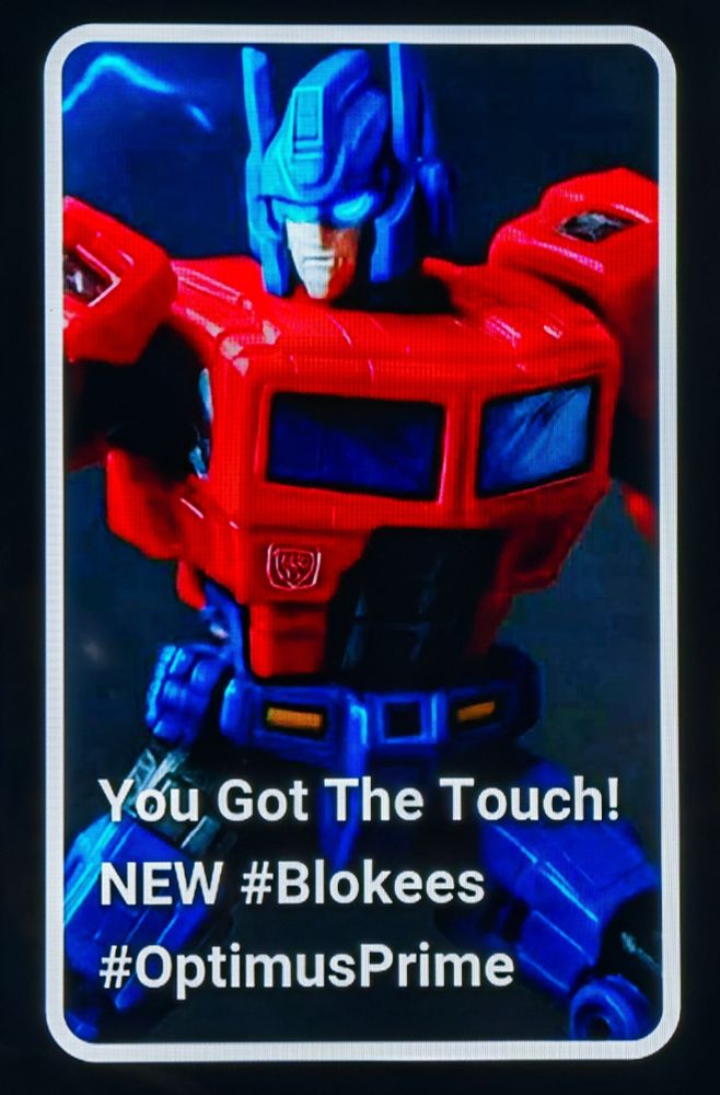 A shitty AI generated image of Optimus Prime which chefatron for some reason used as a thumbnail for this YouTube short in which he unboxed and built an actual Optimus Prime toy
