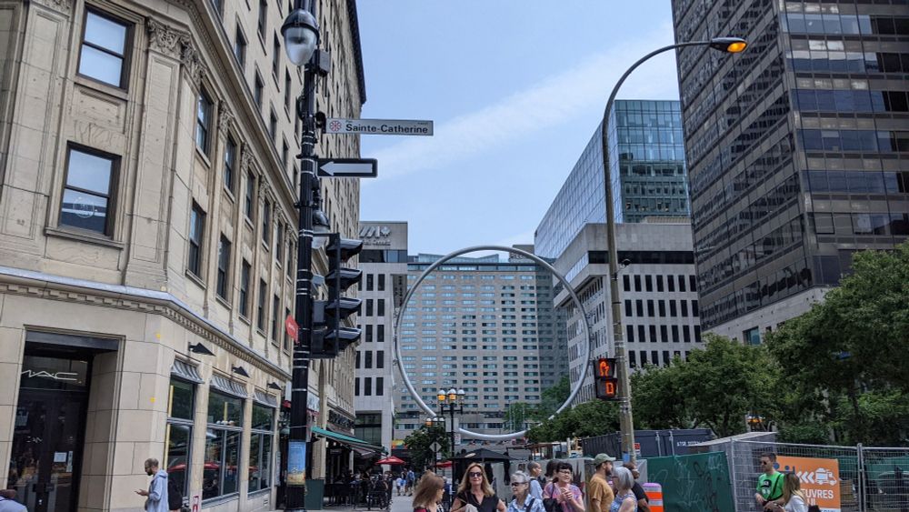 A large metallic ring situated between two buildings near St. Catherine's street in downtown Montreal 