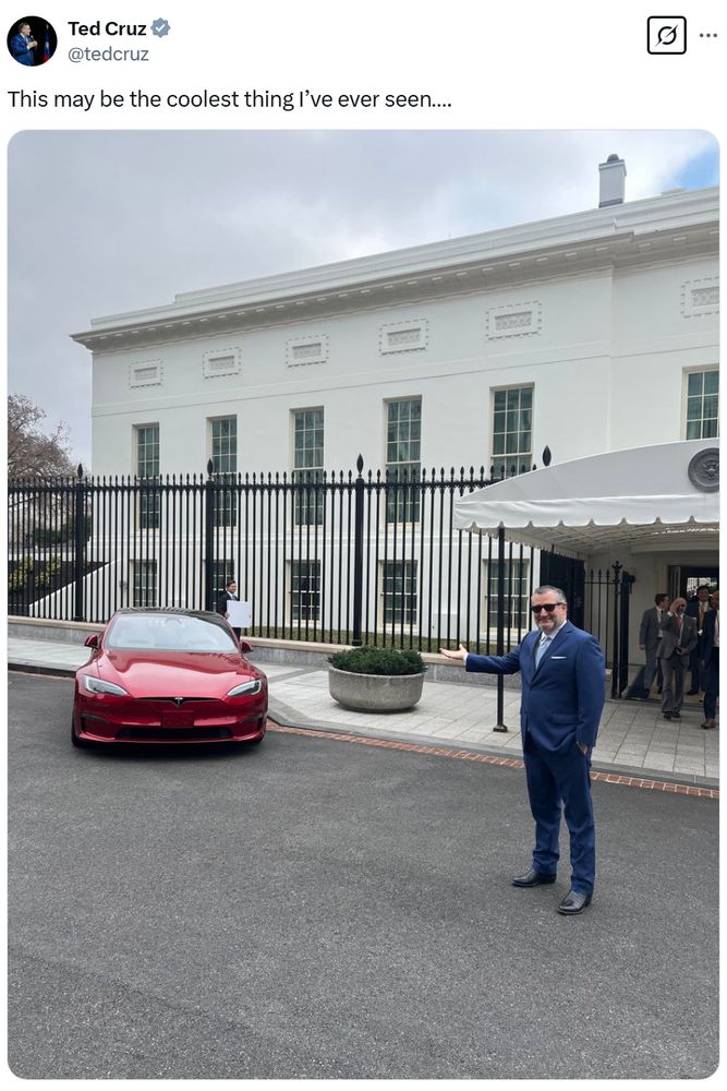 Ted Cruz excitedly pointing at a red car