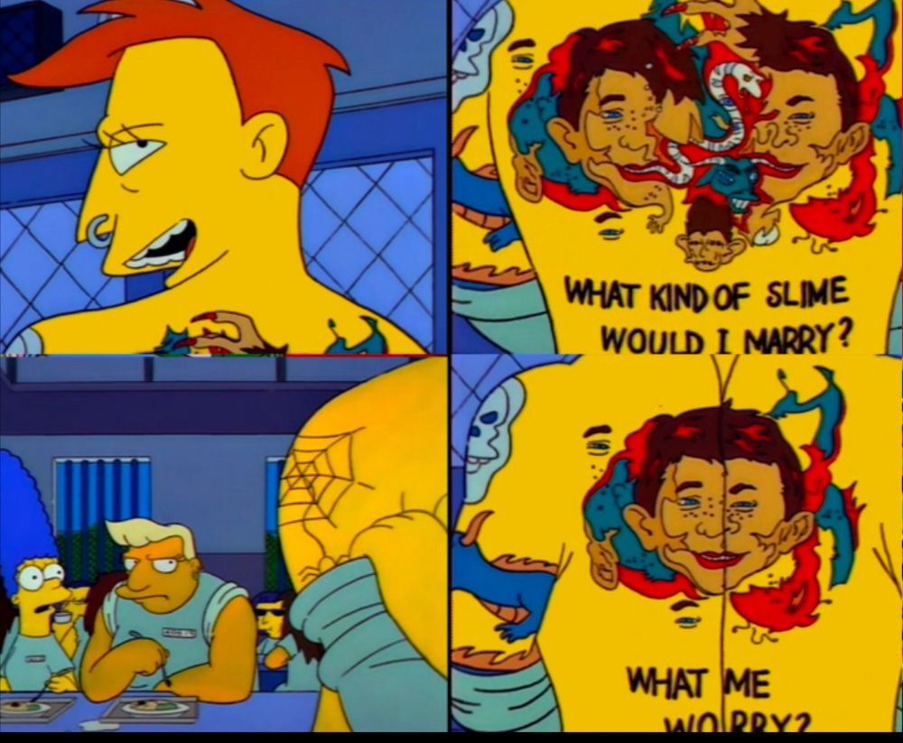 A Simpsons scene in which Marge is befriended in prison by a tattooed lady monster. Back tattoo is from Mad Magazine "What kind of slime would I marry?" Then squishes her back muscles to reveal another message "What me worry?"