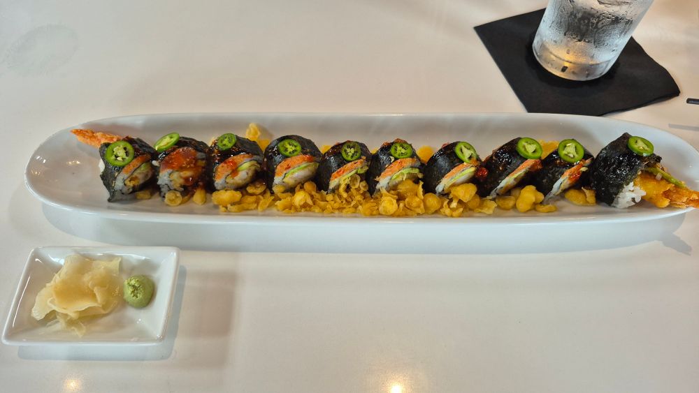 A narrow dish of sushi, super delicious by the way.