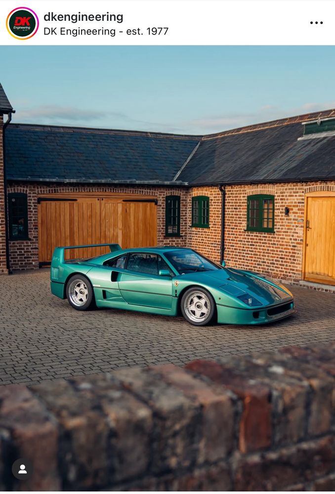A metallic green Peugeot 106
